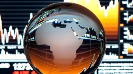 A globe posed on a series of charts.