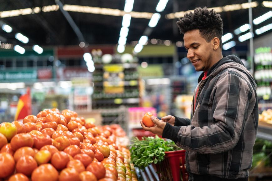 man shopping for produce