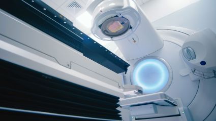 Medical linear accelerator used for radiation therapy in a treatment room.